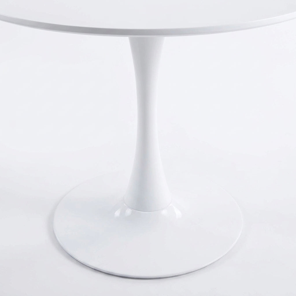 Close-up of the pedestal base and round foot of the white tulip dining table